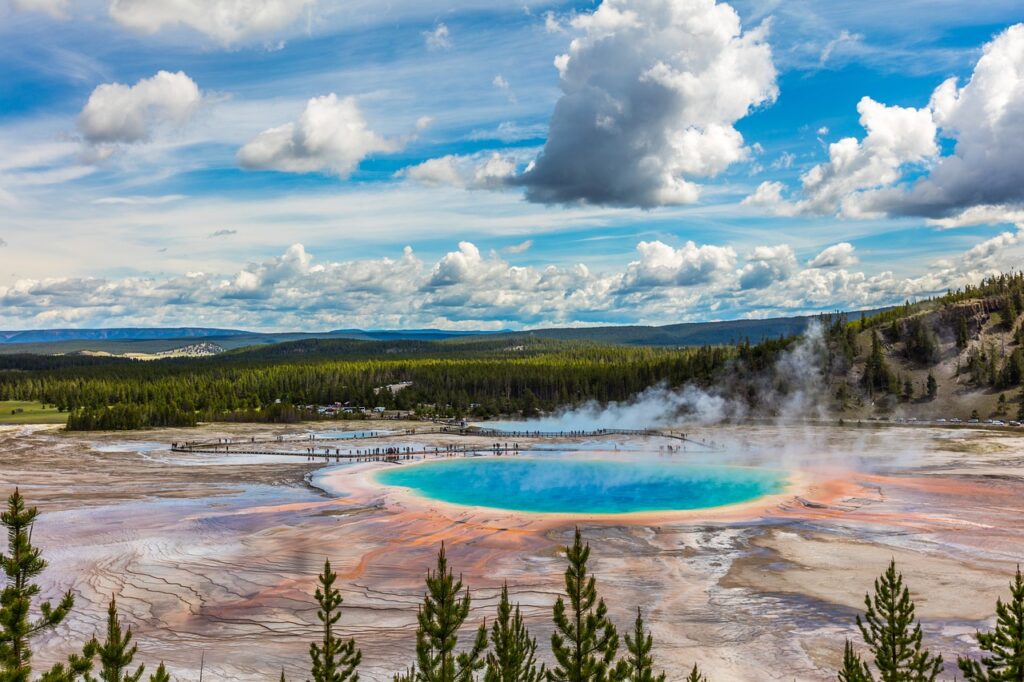 Grand Prismatic Spring with a bright blue center and orange edges seen from above